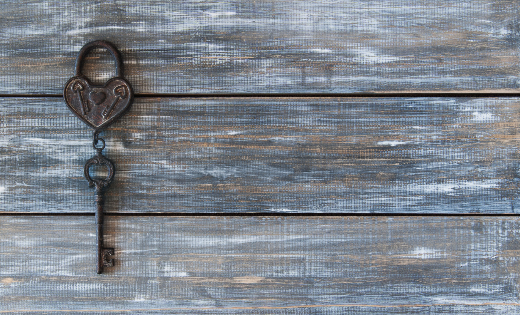 Heart and key on wooden background Valentine's Day