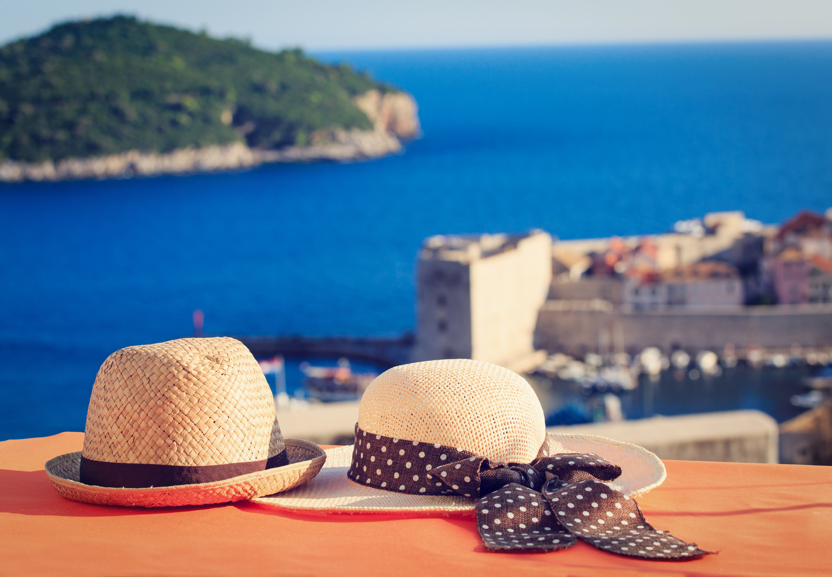 two hats on vacation in Europe, luxury vacation concept